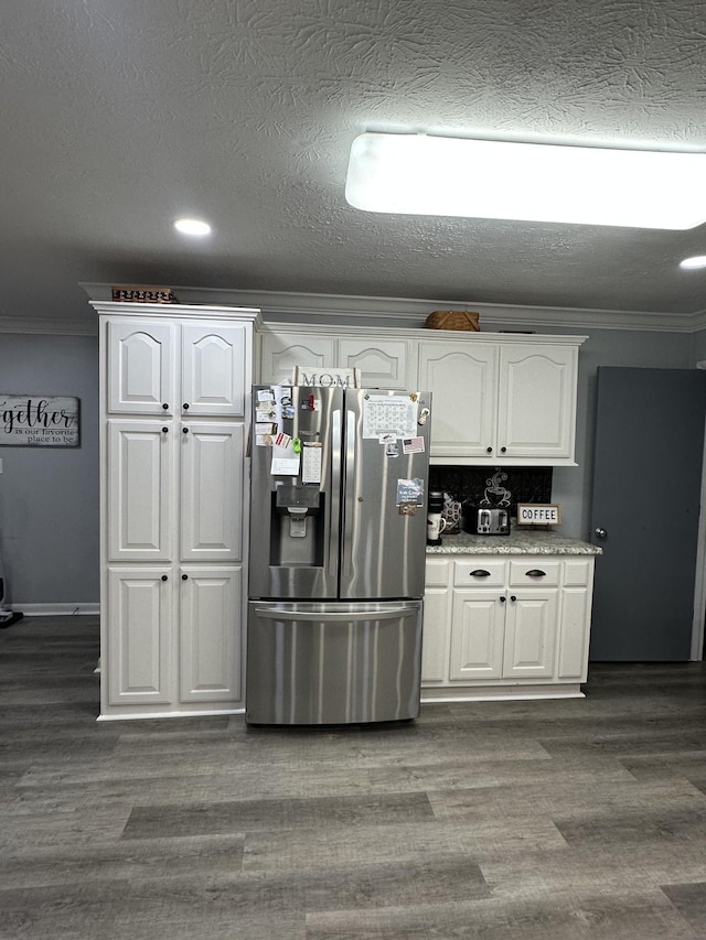 579 Old Celina Rd, Allons, TN 38541 - kitchen with ornamental molding, white cabinets, stainless steel fridge, and dark wood-type flooring