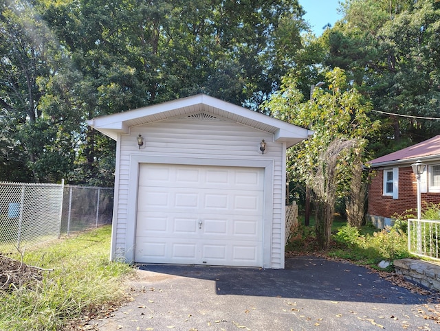 detached garage with fence