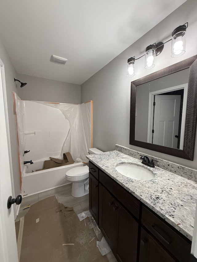 full bathroom with toilet, bathing tub / shower combination, and vanity