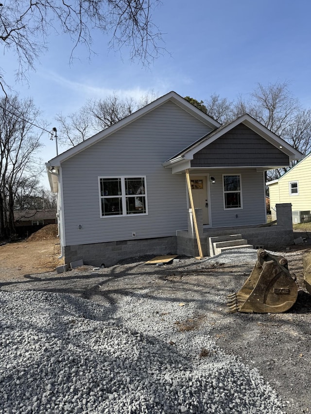 view of front facade with crawl space and covered porch