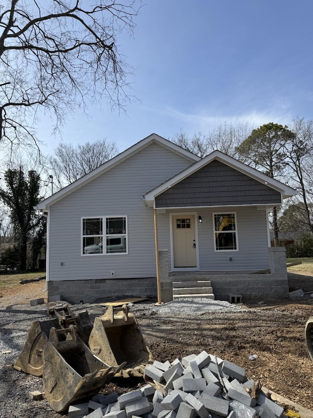 view of front of home with entry steps and crawl space