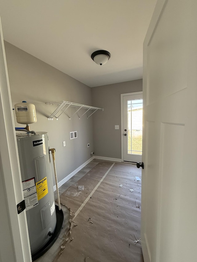 clothes washing area featuring hookup for a washing machine, water heater, hookup for an electric dryer, laundry area, and baseboards