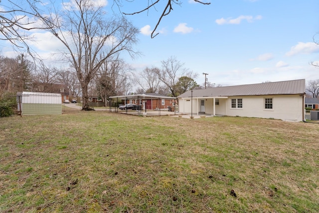 view of yard with a patio area and an outdoor structure