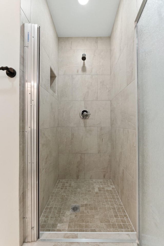 full bath featuring a shower stall