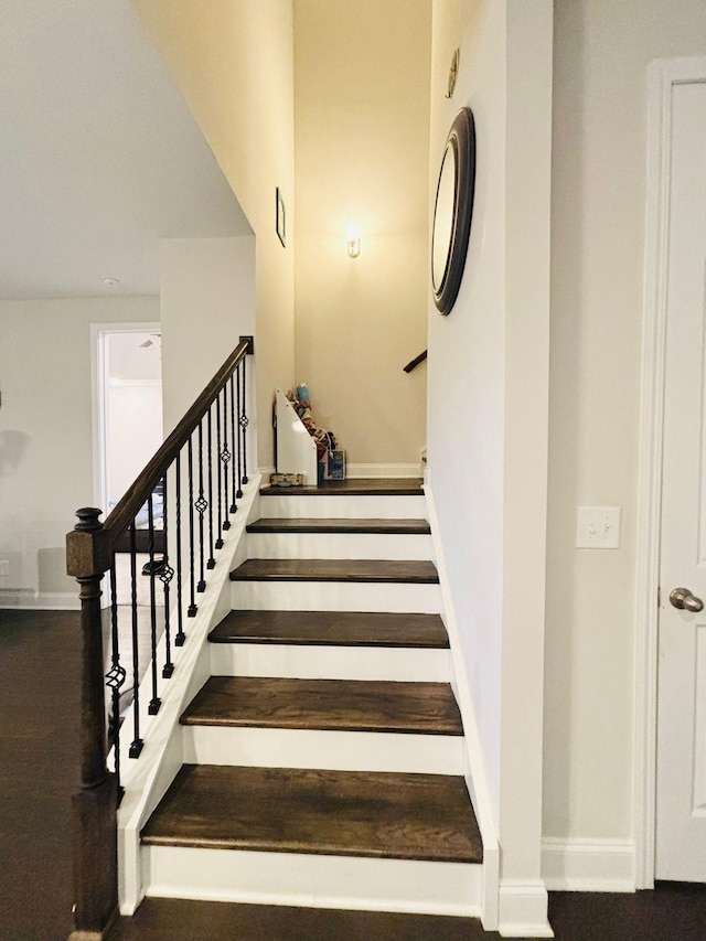 stairs with baseboards