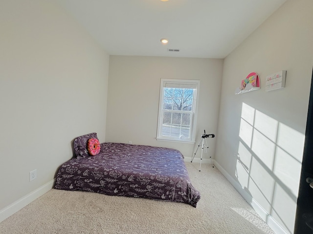 bedroom with baseboards, carpet floors, and visible vents