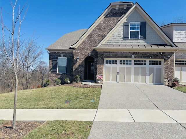 view of front facade featuring concrete driveway, a front yard, a shingled roof, a garage, and brick siding