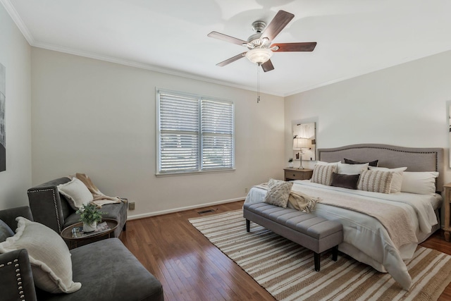 bedroom featuring wood-type flooring, visible vents, ornamental molding, a ceiling fan, and baseboards