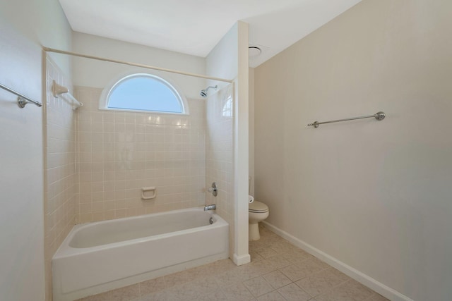 full bathroom featuring washtub / shower combination, tile patterned flooring, baseboards, and toilet