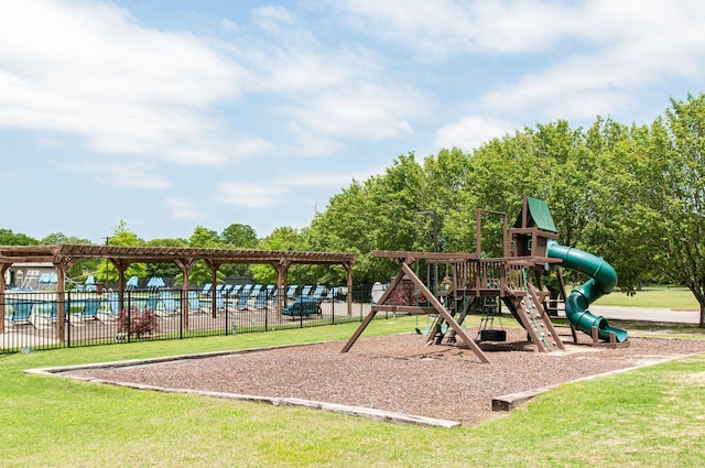 communal playground with a pergola, fence, and a lawn