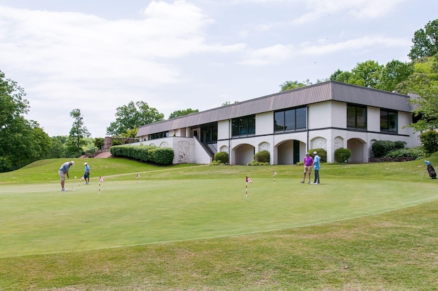 surrounding community featuring a lawn