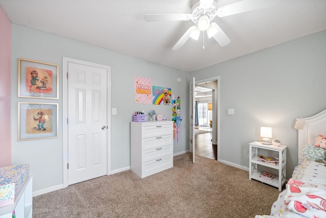 bedroom with a ceiling fan, light carpet, and baseboards