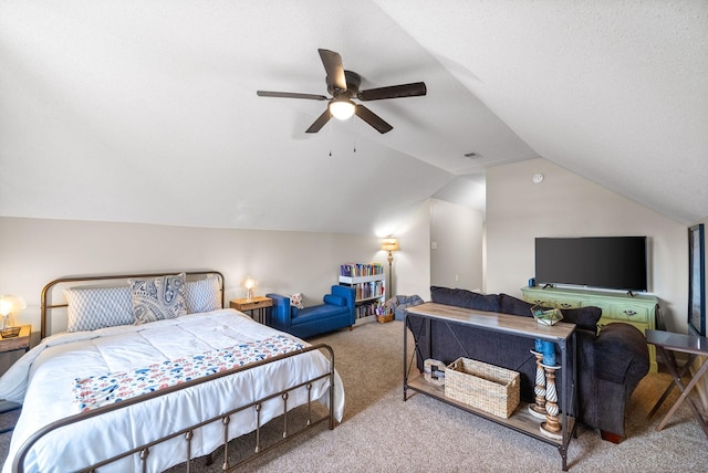 bedroom with carpet, visible vents, vaulted ceiling, and a ceiling fan