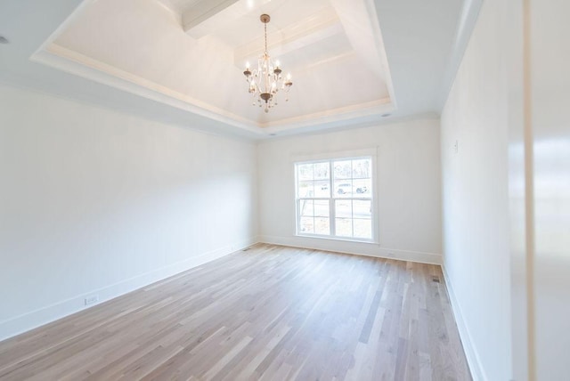 empty room featuring baseboards, a raised ceiling, wood finished floors, beamed ceiling, and a notable chandelier