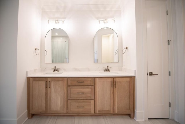 full bath with double vanity and a sink