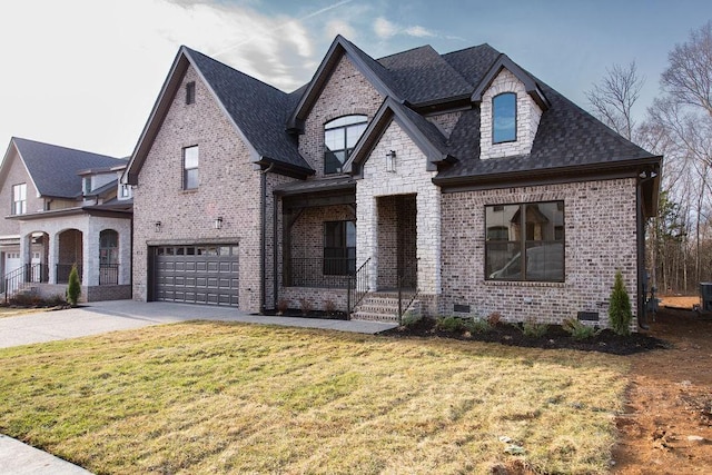 french provincial home featuring crawl space, brick siding, an attached garage, and a front lawn