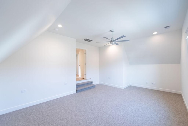 additional living space with baseboards, visible vents, and recessed lighting