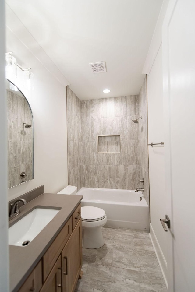 full bathroom with toilet, shower / bathing tub combination, vanity, and visible vents