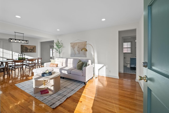 living area featuring light wood finished floors and recessed lighting