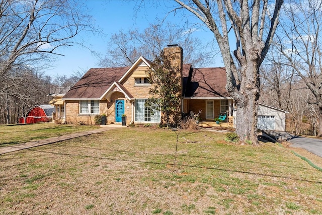 view of front of home with a front yard and a chimney