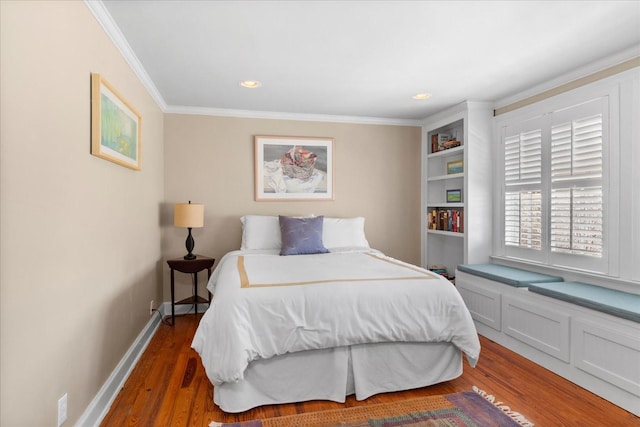 bedroom with ornamental molding, recessed lighting, wood finished floors, and baseboards