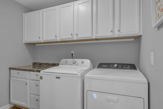 laundry room featuring cabinet space and washing machine and dryer