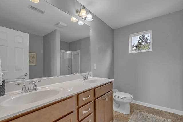 full bathroom with double vanity, a shower stall, visible vents, and a sink