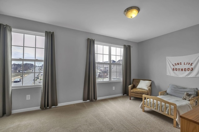 carpeted bedroom with baseboards