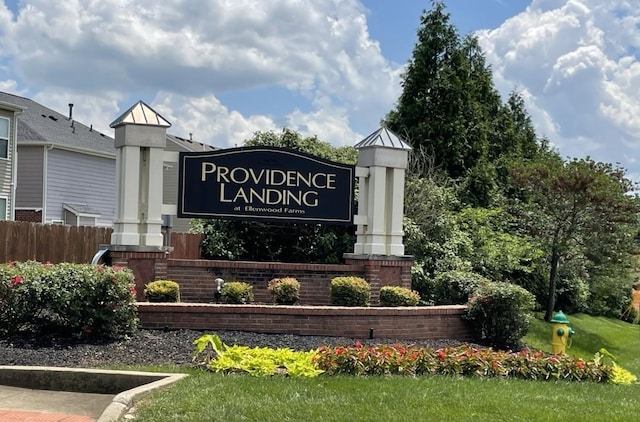 community sign with fence