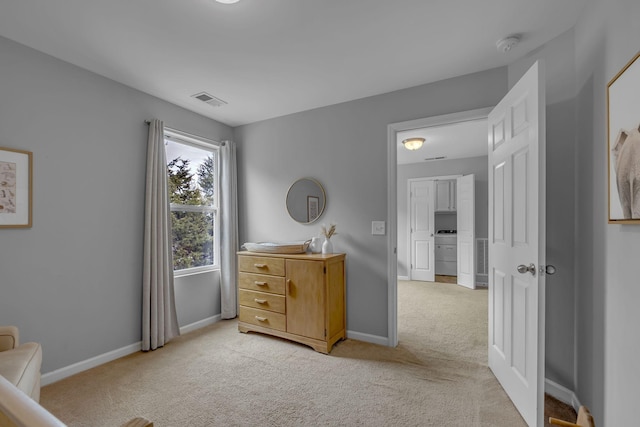 bedroom with light carpet, baseboards, and visible vents