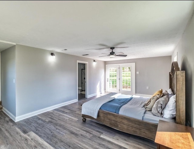 bedroom featuring ceiling fan, wood finished floors, visible vents, and baseboards