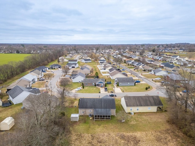 birds eye view of property with a residential view