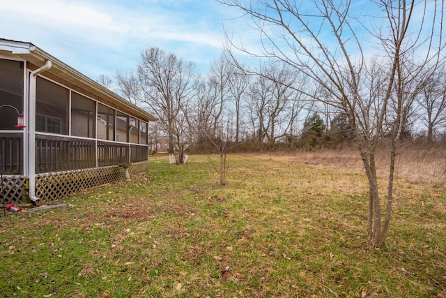 view of yard featuring a sunroom