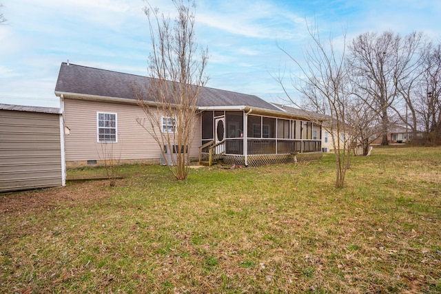 back of house with a yard, crawl space, and a sunroom