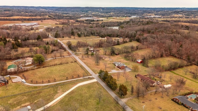 birds eye view of property with a rural view