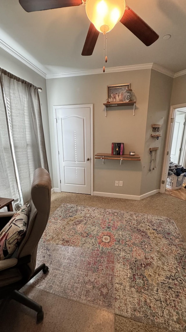 carpeted office featuring ceiling fan, ornamental molding, and baseboards