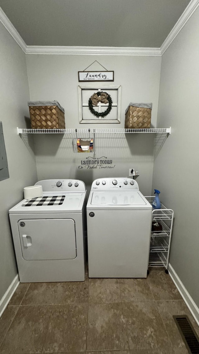 clothes washing area with visible vents, ornamental molding, washer and dryer, laundry area, and baseboards