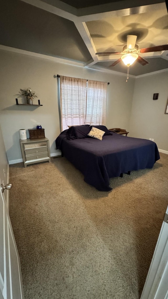 carpeted bedroom featuring ceiling fan, ornamental molding, and baseboards