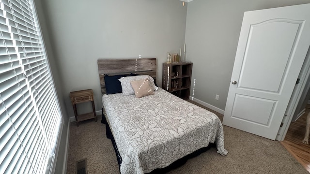 bedroom with visible vents and baseboards