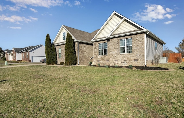 view of front facade featuring a front yard, fence, a garage, crawl space, and brick siding