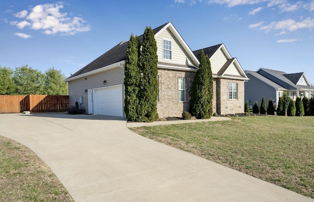 view of front of house featuring driveway, fence, a front yard, a garage, and brick siding