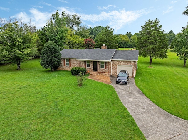 ranch-style home featuring brick siding, a chimney, an attached garage, a front yard, and driveway