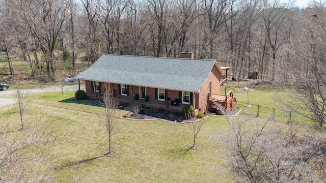 aerial view featuring a wooded view