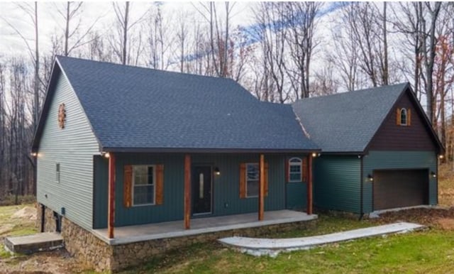 1319 Cemetery Rd, Auburn, KY 42206 - view of front of property featuring a porch, an attached garage, and a shingled roof