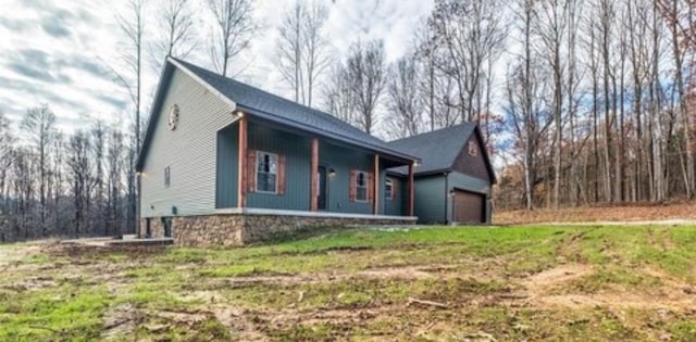1319 Cemetery Rd, Auburn, KY 42206 - view of front facade with a garage and covered porch