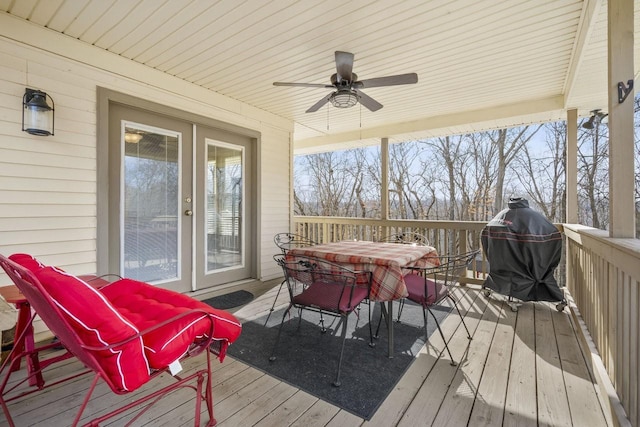 deck with ceiling fan and outdoor dining space