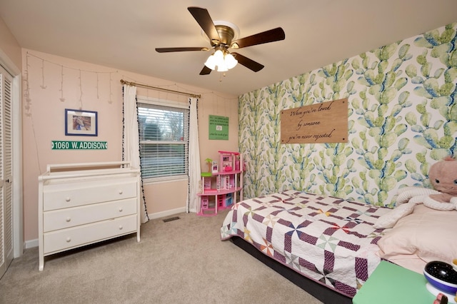 bedroom featuring ceiling fan, visible vents, baseboards, carpet, and wallpapered walls