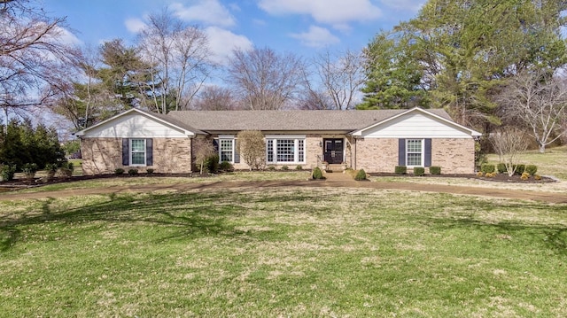 ranch-style house with brick siding and a front yard