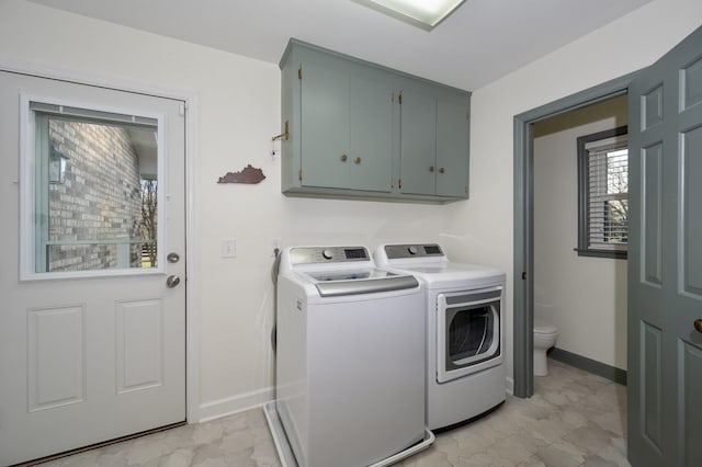 laundry room with marble finish floor, cabinet space, washer and clothes dryer, and baseboards