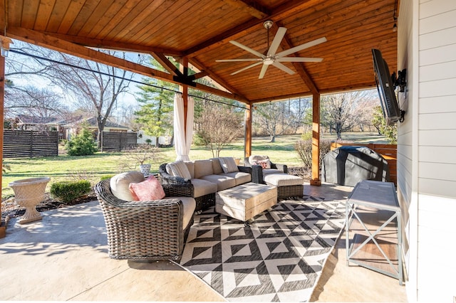 view of patio with ceiling fan, fence, and outdoor lounge area